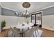 Elegant dining room with chandelier, hardwood floors, and access to patio at 2500 Cottonwood Dr, Marietta, GA 30066