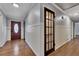 Bright entryway with hardwood floors, wood door, and wainscoting at 2500 Cottonwood Dr, Marietta, GA 30066