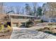 Ranch home with a brick facade and a large driveway at 2500 Cottonwood Dr, Marietta, GA 30066