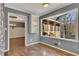 Kitchen nook with built-in shelving and large window overlooking backyard at 2500 Cottonwood Dr, Marietta, GA 30066