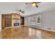 Bright living room with hardwood floors and a stone fireplace at 2500 Cottonwood Dr, Marietta, GA 30066