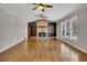 Hardwood floors, stone fireplace, and ceiling fans in living room at 2500 Cottonwood Dr, Marietta, GA 30066