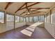 Bright screened porch with wood-look floors and ceiling fan at 2500 Cottonwood Dr, Marietta, GA 30066