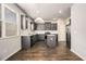 Modern kitchen with gray cabinets and granite countertops at 2784 Cypress Rdg, Loganville, GA 30052