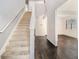 Elegant staircase with carpeted steps and hardwood floors at 2784 Cypress Rdg, Loganville, GA 30052