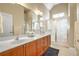 Elegant bathroom with dual vanities and a large shower at 340 Glens Way, Woodstock, GA 30188