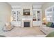 Living room with built-in shelving, fireplace, and comfortable seating at 340 Glens Way, Woodstock, GA 30188