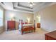 Main bedroom with tray ceiling and hardwood floors at 340 Glens Way, Woodstock, GA 30188