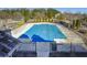 Community pool with safety cover, surrounded by a fence at 340 Glens Way, Woodstock, GA 30188