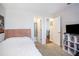 Spacious bedroom with plenty of closet space and a TV at 631 Granville Ct, Atlanta, GA 30328