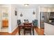 Bright dining area with a wood table and teal chairs next to bathroom at 631 Granville Ct, Atlanta, GA 30328