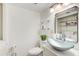 Clean bathroom with glass vessel sink and shelving at 6900 Roswell Rd, Atlanta, GA 30328