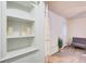 Bright built-in shelves with decorative items, located in a hallway at 6900 Roswell Rd # 3B, Atlanta, GA 30328