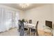 Dining area with glass table and French doors at 6900 Roswell Rd, Atlanta, GA 30328