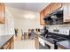 Open kitchen with stainless steel appliances and breakfast nook at 6900 Roswell Rd # 3B, Atlanta, GA 30328