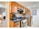 Modern kitchen with stainless steel appliances and dark countertops at 6900 Roswell Rd, Atlanta, GA 30328