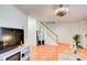 Open living space with hardwood floors and stairs at 6900 Roswell Rd # 3B, Atlanta, GA 30328