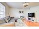 Modern living room featuring hardwood floors and TV at 6900 Roswell Rd, Atlanta, GA 30328