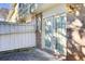 Small patio area with brick wall and French doors at 6900 Roswell Rd, Atlanta, GA 30328