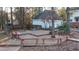 View of back deck featuring built-in seating and a wooded backyard at 850 Airline Rd, Mcdonough, GA 30252