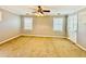 Bedroom with neutral paint, ceiling fan with light, carpet, and natural light from windows at 850 Airline Rd, Mcdonough, GA 30252