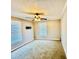 Neutral bedroom with carpet and two large windows that let in plenty of natural light at 850 Airline Rd, Mcdonough, GA 30252