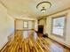 Bright living room with wood floors, fireplace, and natural light from large windows at 850 Airline Rd, Mcdonough, GA 30252