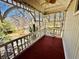 View of a porch with carved white trim and red painted floor at 850 Airline Rd, Mcdonough, GA 30252