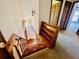 Carpeted staircase with decorative wood accents and built-in bookshelf at 850 Airline Rd, Mcdonough, GA 30252