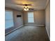 Spacious bedroom with neutral walls, ceiling fan, and carpet flooring at 850 Airline Rd, Mcdonough, GA 30252