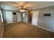 Spacious bedroom with carpet, ceiling fan, and ample closet space at 850 Airline Rd, Mcdonough, GA 30252