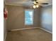 Well-lit bedroom featuring carpet, a large window, and neutral walls at 850 Airline Rd. Rd, Mcdonough, GA 30252