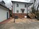 Home's rear elevation showcasing a deck and detached garage at 850 Airline Rd. Rd, Mcdonough, GA 30252