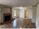 Living room with hardwood floors and brick fireplace at 850 Airline Rd, Mcdonough, GA 30252