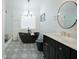 Modern bathroom with black freestanding tub, patterned floor tile, and double vanity at 12558 Lakeside Pkwy, Fayetteville, GA 30215