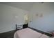 Charming bedroom featuring a pink quilt and dark wood floors at 12558 Lakeside Pkwy, Fayetteville, GA 30215