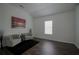 Bright bedroom with hardwood floors and neutral walls at 12558 Lakeside Pkwy, Fayetteville, GA 30215