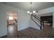 Bright dining room with chandelier and view of kitchen at 12558 Lakeside Pkwy, Fayetteville, GA 30215