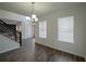 Spacious dining room with hardwood floors and large windows at 12558 Lakeside Pkwy, Fayetteville, GA 30215