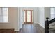 Bright entryway with hardwood floors and a wood door with glass accents at 12558 Lakeside Pkwy, Fayetteville, GA 30215