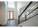 Two-story entryway with hardwood floors and a wood door with glass at 12558 Lakeside Pkwy, Fayetteville, GA 30215