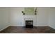 Living room fireplace with white mantel and mosaic tile surround at 12558 Lakeside Pkwy, Fayetteville, GA 30215