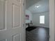 Hallway with view of sitting area and wood floors at 12558 Lakeside Pkwy, Fayetteville, GA 30215