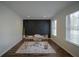 Modern home office with dark geometric accent wall and hardwood floors at 12558 Lakeside Pkwy, Fayetteville, GA 30215