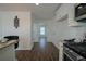 Kitchen with view into adjacent living space, featuring hardwood floors at 12558 Lakeside Pkwy, Fayetteville, GA 30215