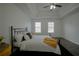 Main bedroom with tray ceiling, dark hardwood floors and ceiling fan at 12558 Lakeside Pkwy, Fayetteville, GA 30215