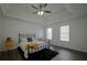 Spacious main bedroom with tray ceiling, dark hardwood floors, and a ceiling fan at 12558 Lakeside Pkwy, Fayetteville, GA 30215