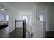 Upstairs hallway with dark hardwood floors and access to bedrooms at 12558 Lakeside Pkwy, Fayetteville, GA 30215