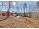 Large backyard with a wooden deck and a view of a wooded area at 180 Paces Lakes Pointe St, Dallas, GA 30157