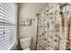 Small bathroom with shower/tub combo and window at 180 Paces Lakes Pointe St, Dallas, GA 30157